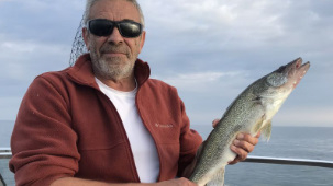 Angler holding a 9-inch fish in FL