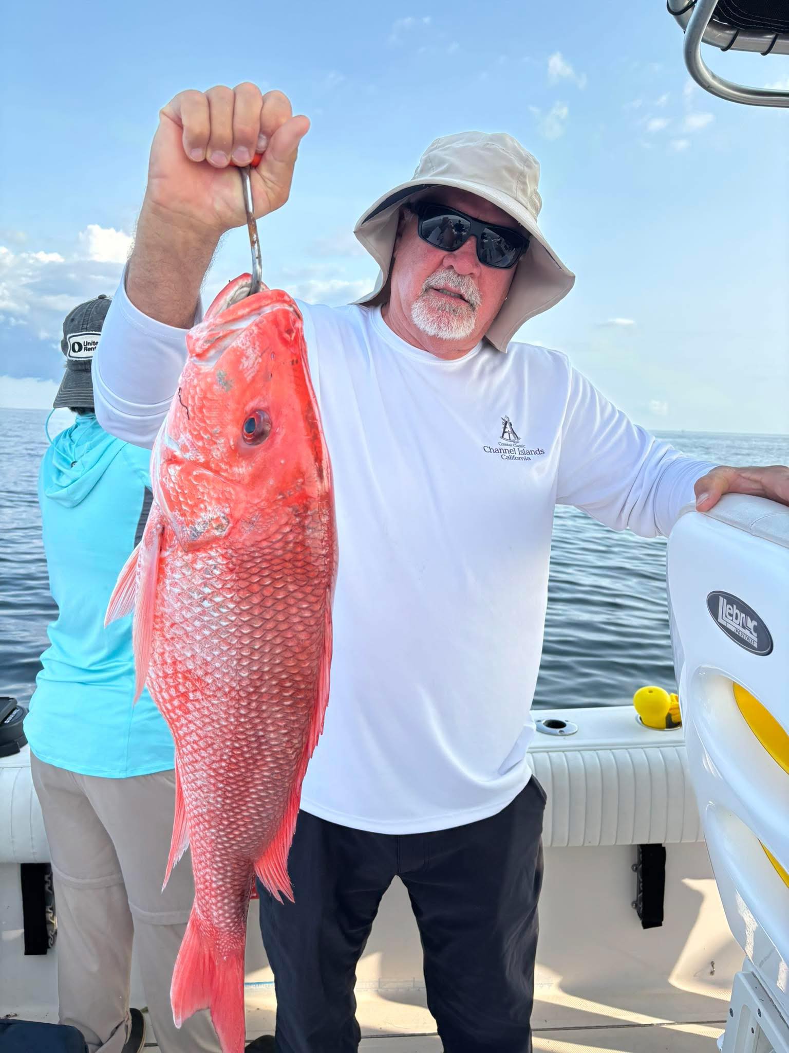 Red snapper fishing charter boat in Gulf of Mexico waters near Biloxi MS with anglers aboard