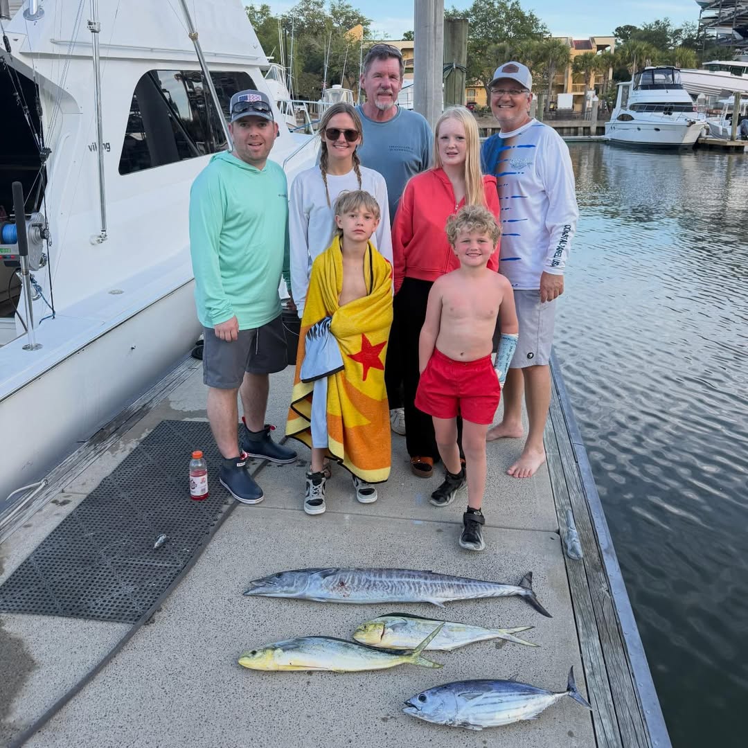 Fishing charter catch display showing skipjack tuna and wahoo from Charleston SC waters with multiple fish species laid out on boat deck