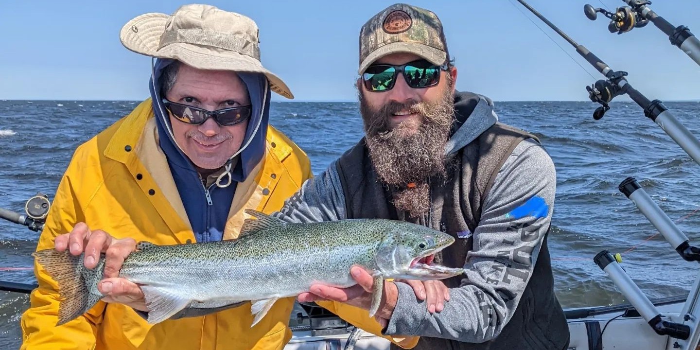 Lake Superior fishing charter boat with anglers catching trout and salmon on full day trip