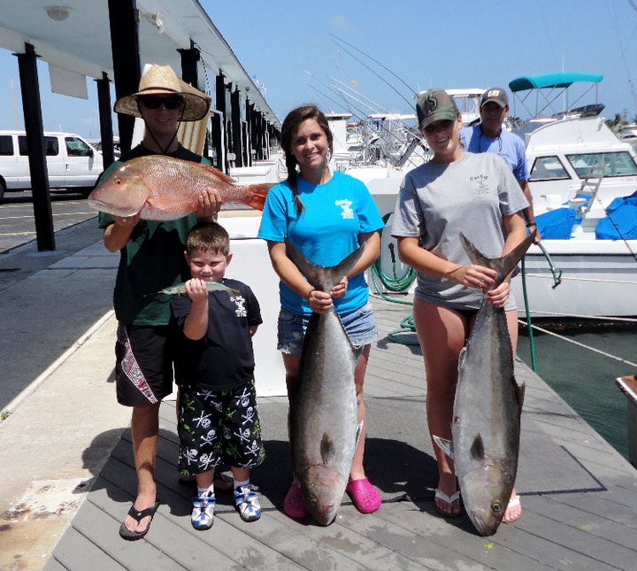 5 anglers catching 3 big fish while fishing in Key West