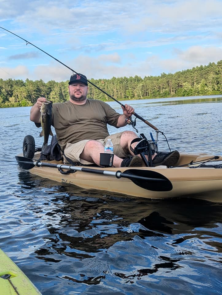 Angler fishing with rod and reel in MA