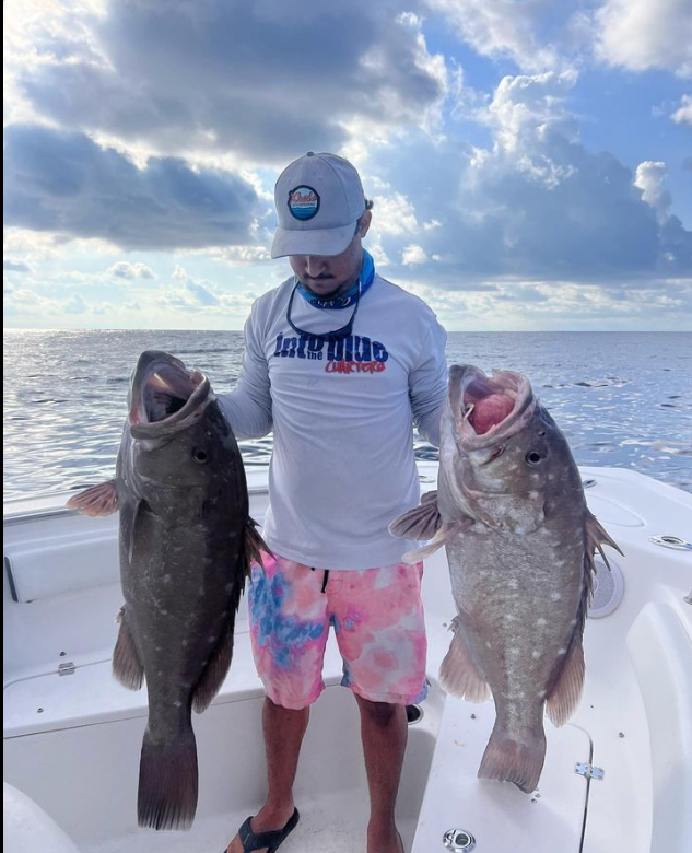 2 red grouper fish caught in FL
