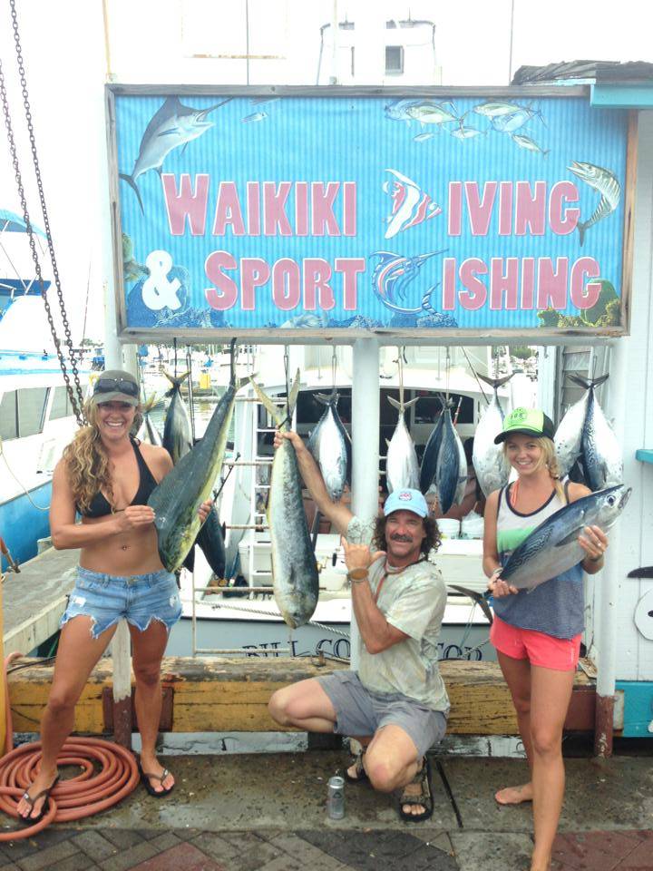 Three anglers in Honolulu with three large fish
