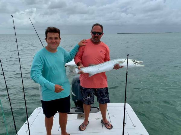 Two people enjoying a scenic fishing trip in Cudjoe Key