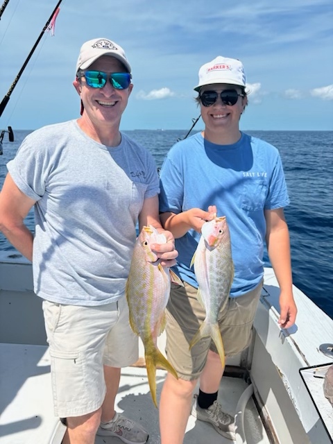 Key West reef fishing charter boat with anglers catching snapper and grouper in Florida Keys