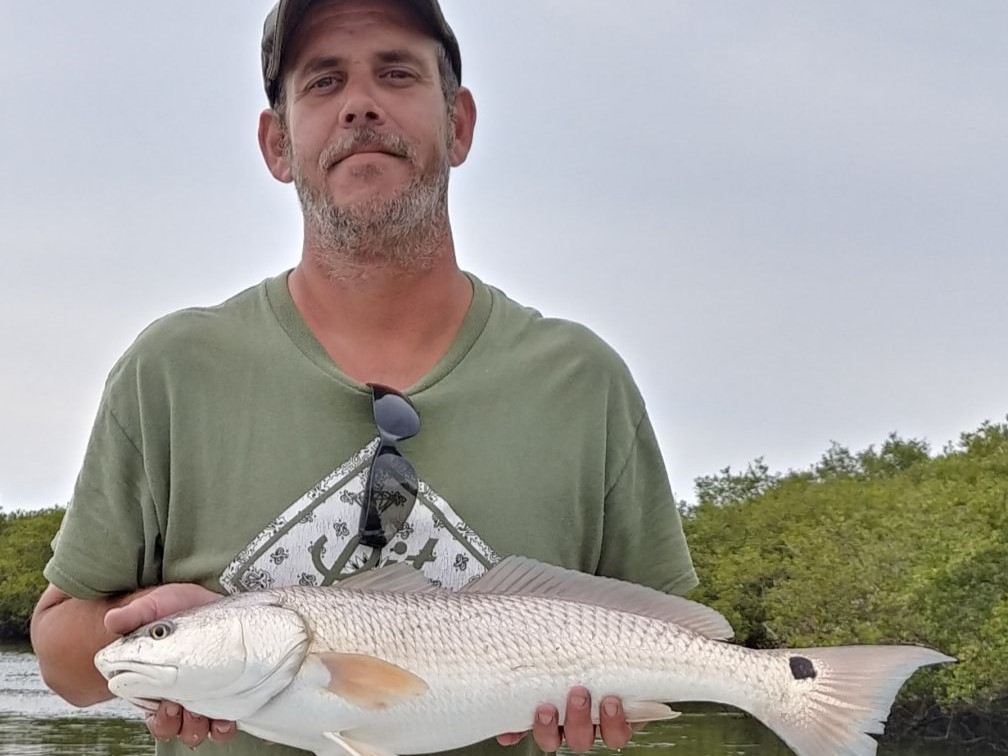 A Redfish measuring 23 inches caught during a fishing trip in St. Augustine