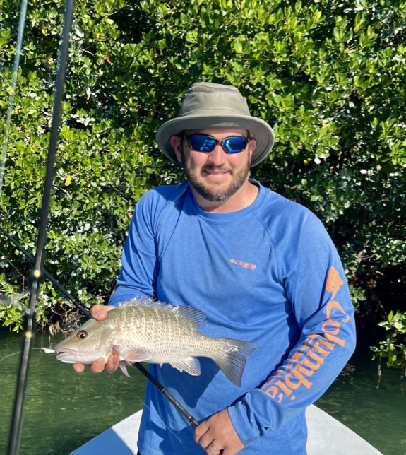 Angler with fishing rod enjoying the scenic location of Key West