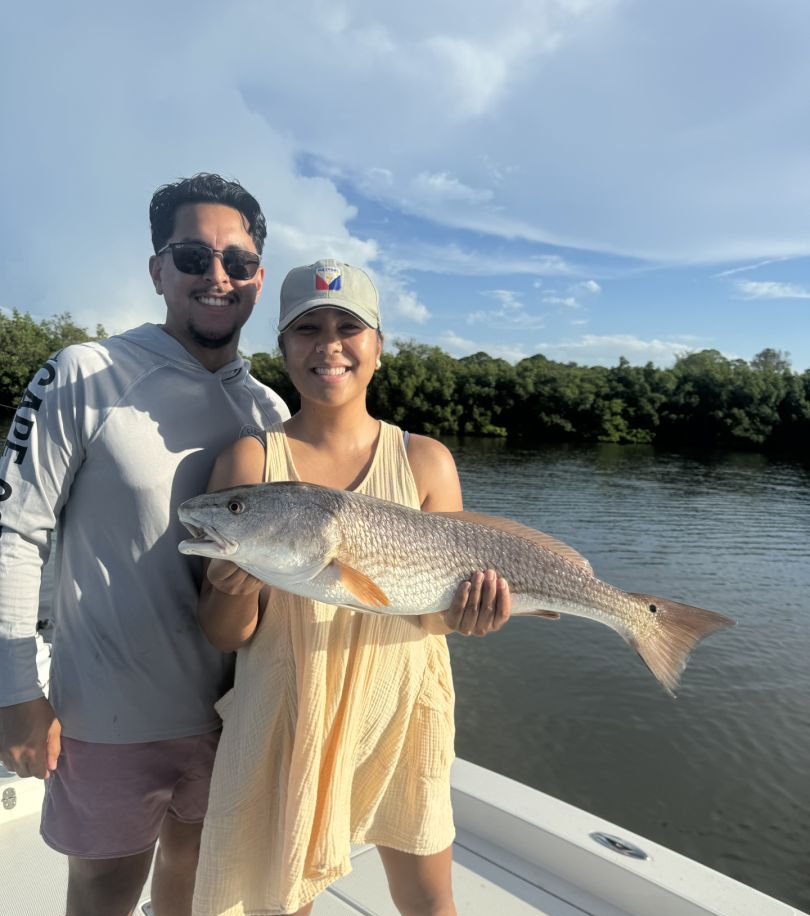 Redfish catch, 24-inch fish, fishing in Indian Shores