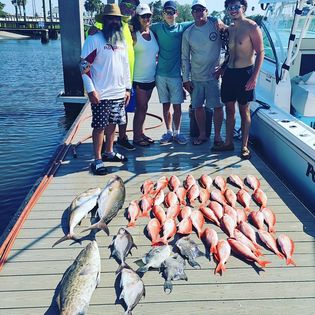 Two people enjoying a fishing trip in Fernandina Beach
