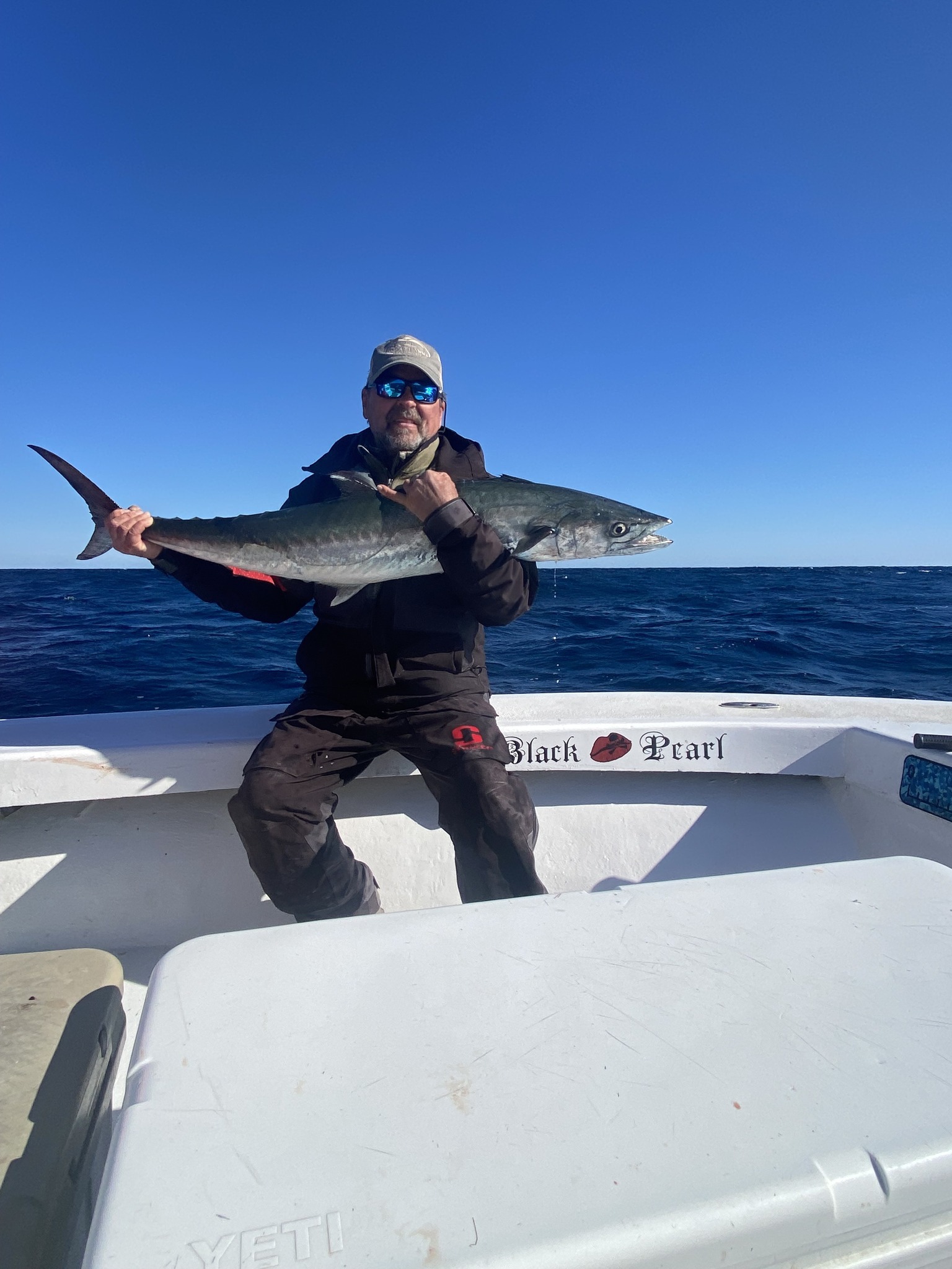 King mackerel catch displayed on fishing boat deck in Hatteras NC waters