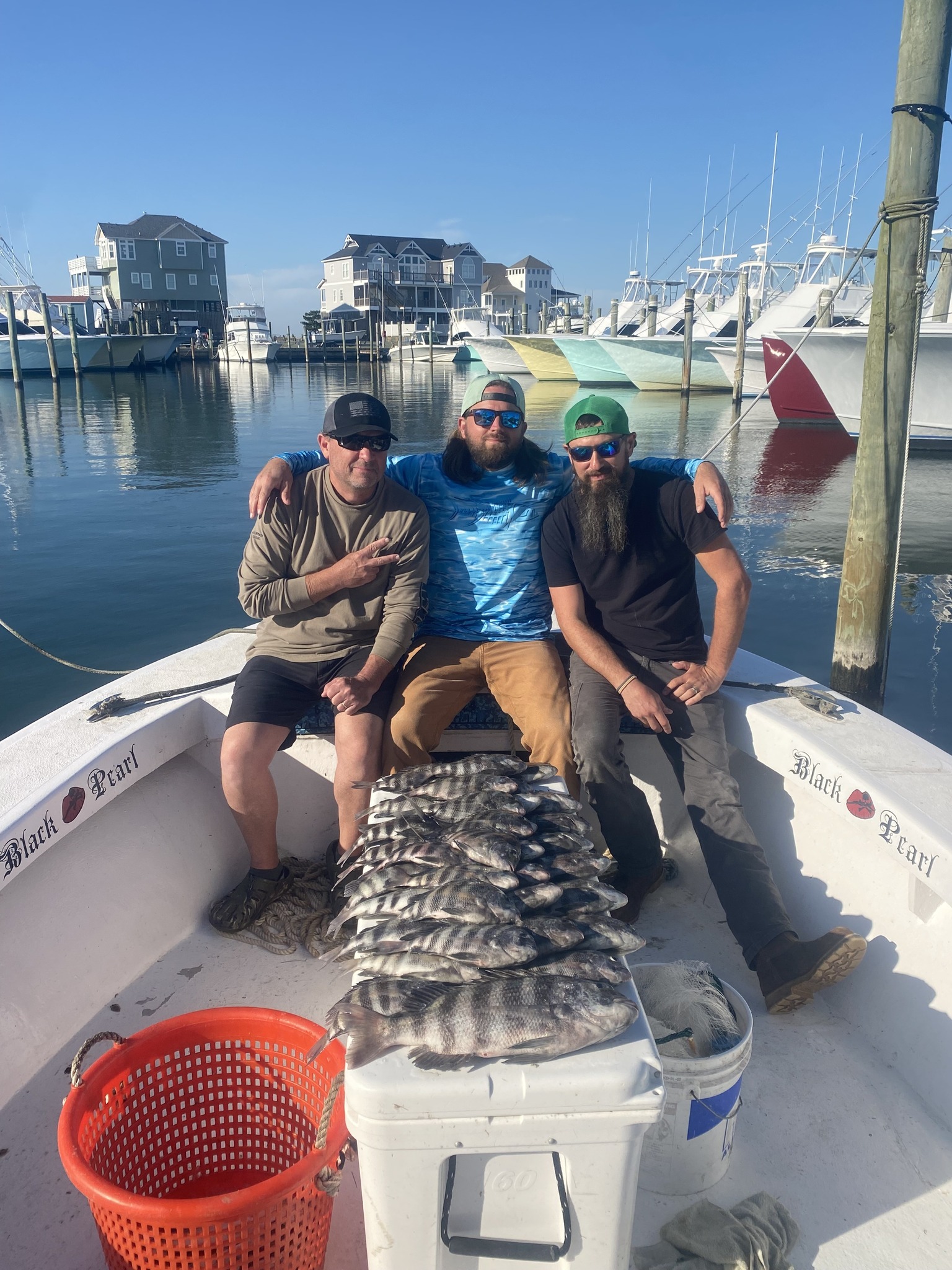 Successful sheepshead fishing trip in Hatteras NC with large catch displayed on boat deck