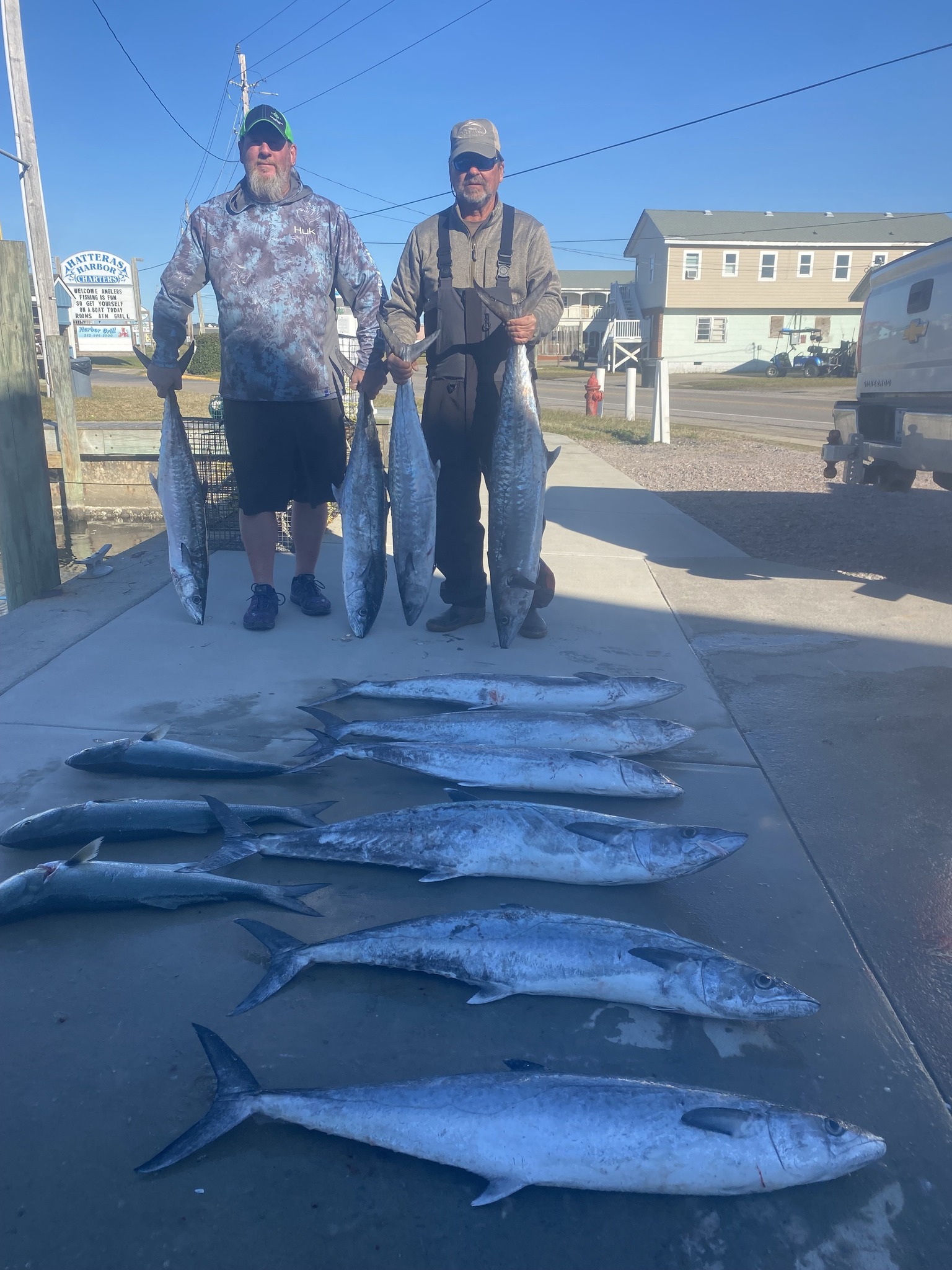 King mackerel fishing catch displayed on dock in Hatteras NC with multiple large fish