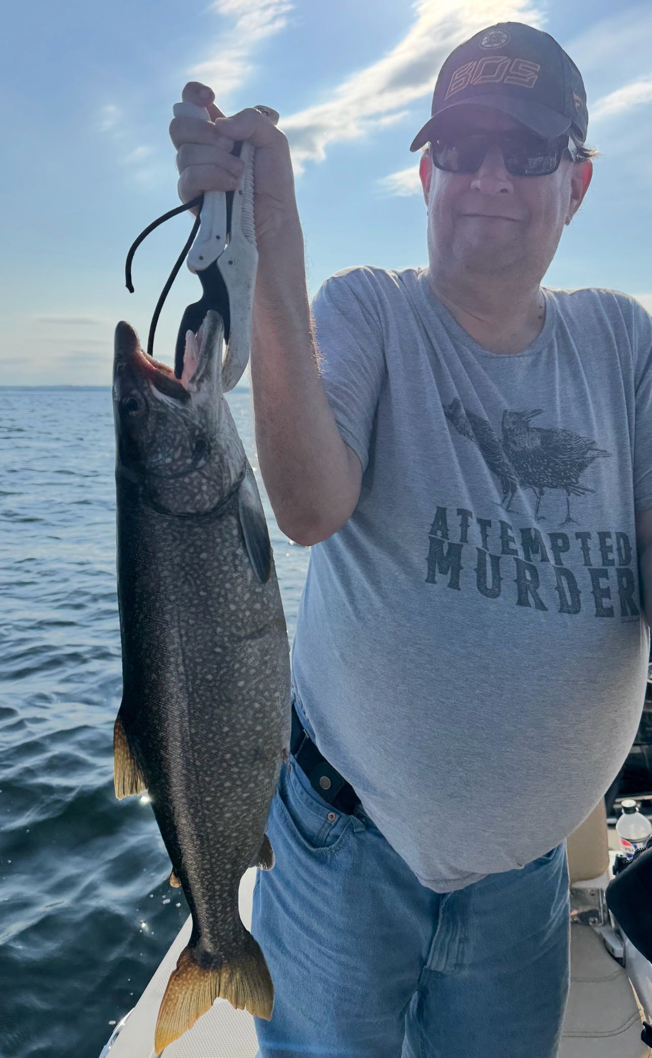 Lake trout caught fishing in Peru NY held up on boat