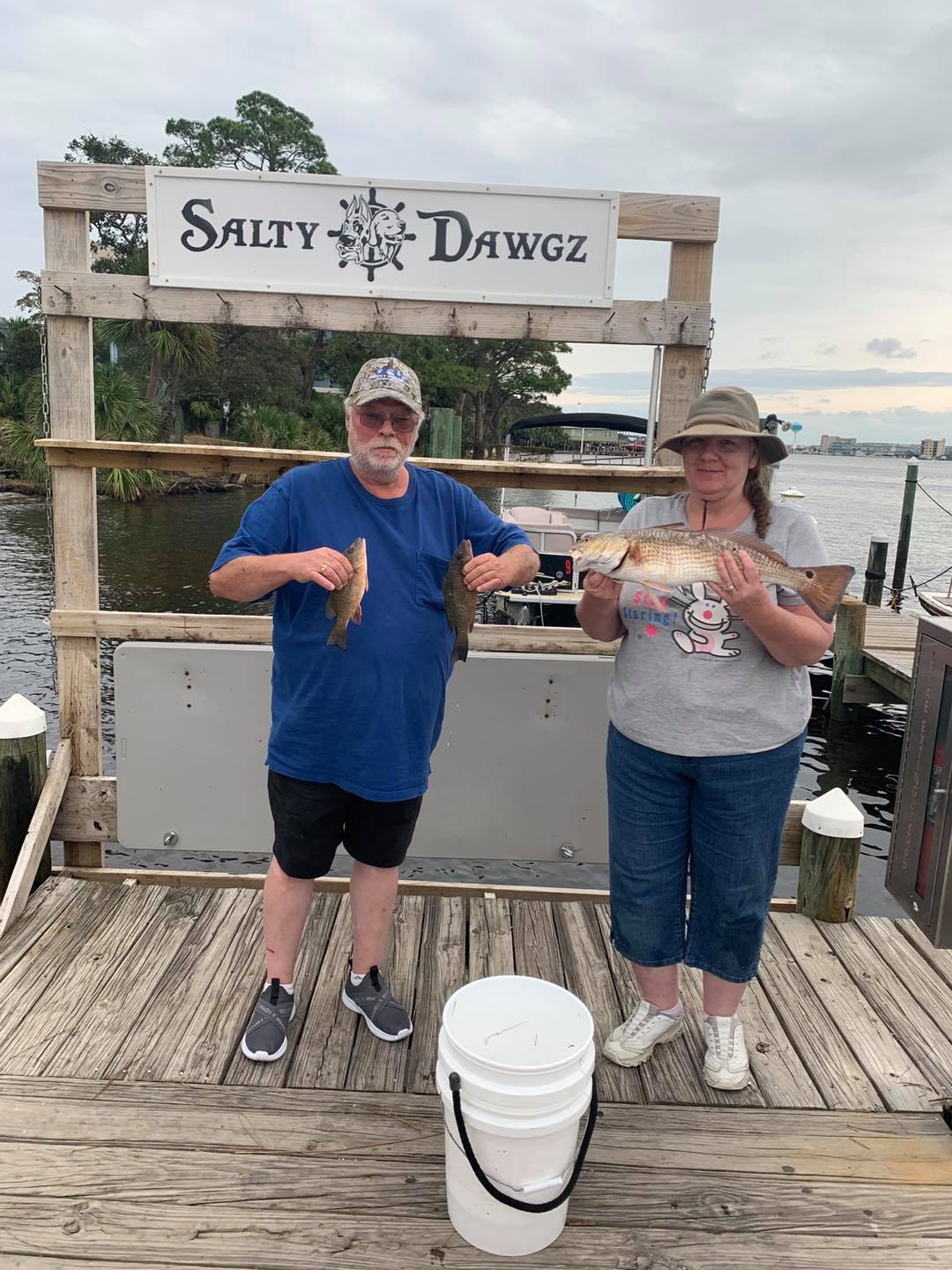 Two people enjoying the scenic view at Fort Walton Beach
