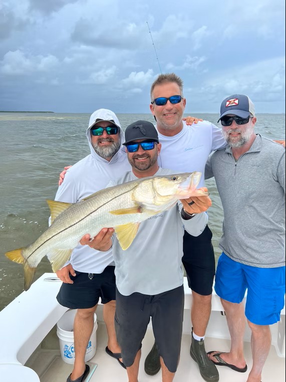 Snook, a 28-inch fish, caught by 4 people fishing in Holmes Beach