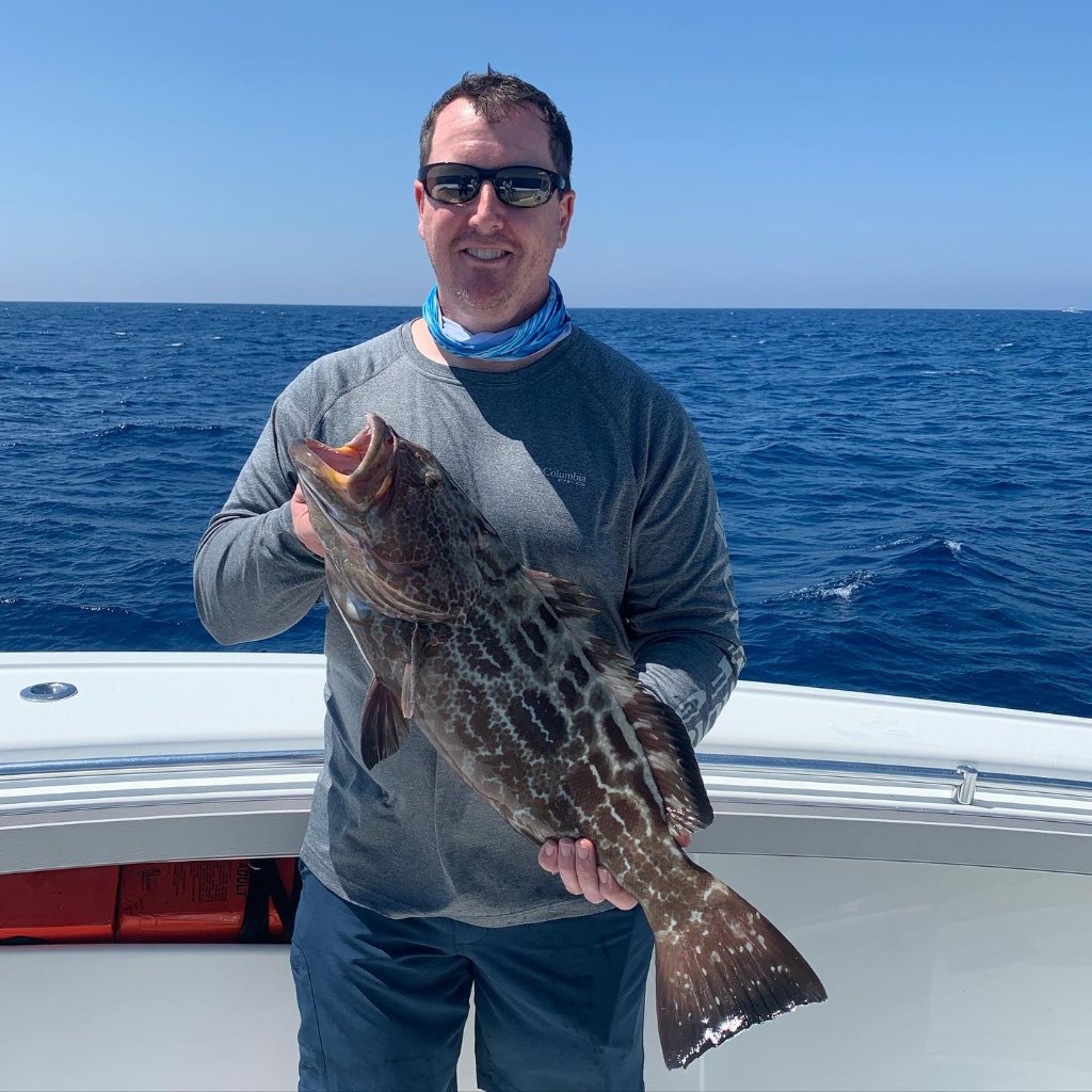 A person fishing for a black grouper in Florida