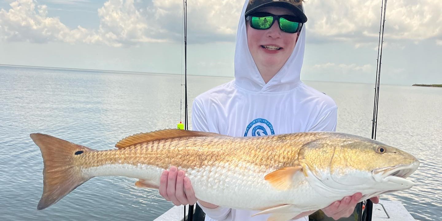 Louisiana inshore fishing charter boat targeting redfish and trout on coastal waters
