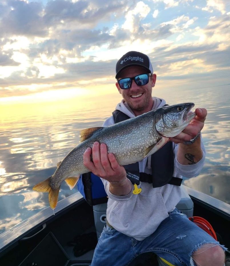 Anglers with a big fish in Hamilton