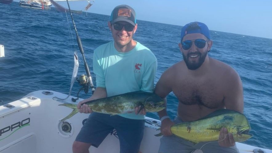 2 fishermen catching big fish in TX