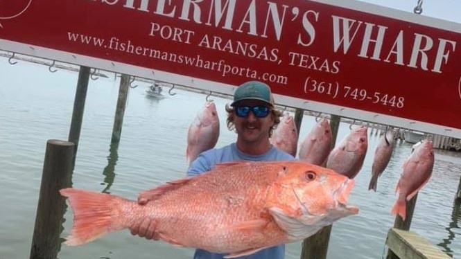 Angler posing with a fish in Port Aransas