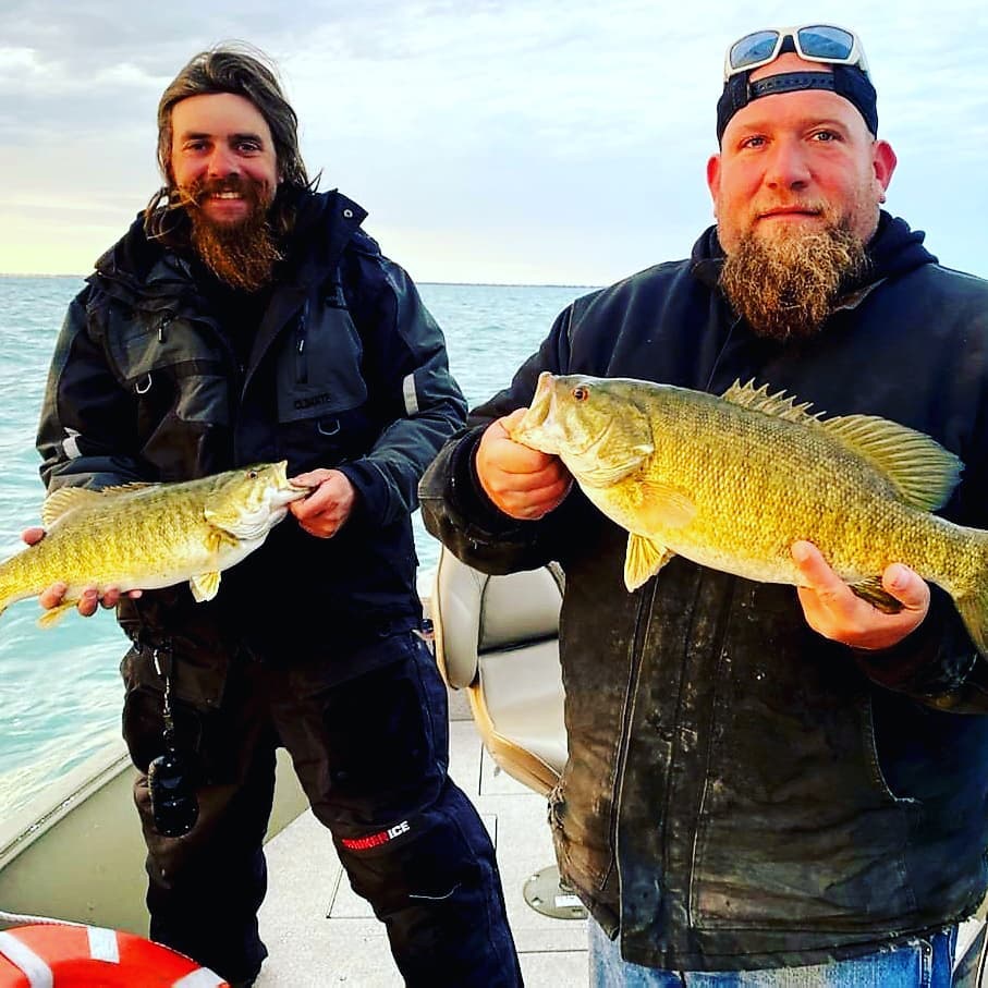 Two anglers fishing in MI with big fish