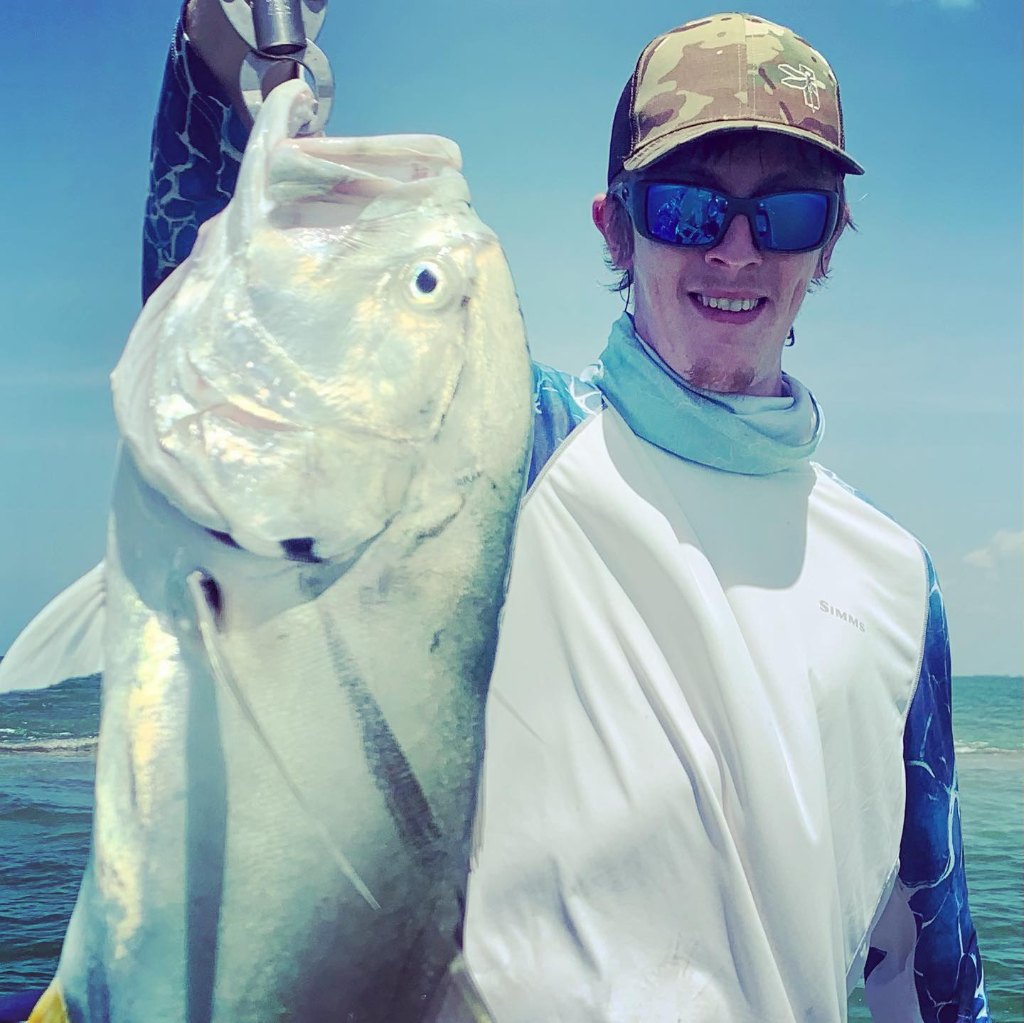 Angler holding a 19-inch fish in MI