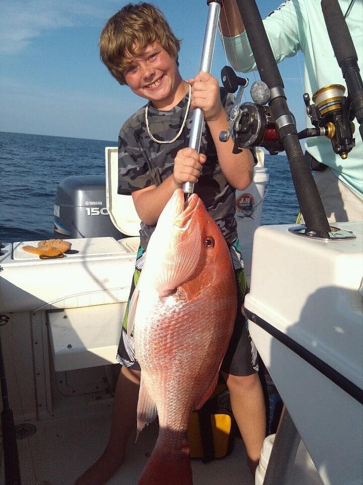 One angler with big fish caught at Fort Morgan