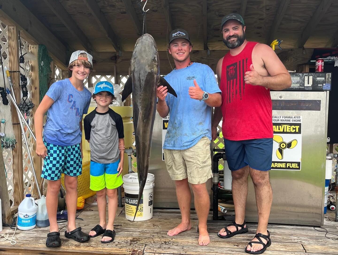 4 people fishing at Fort Morgan