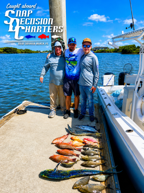 Fishing charter boat with mixed catch of various fish species displayed on deck at New Smyrna Beach FL