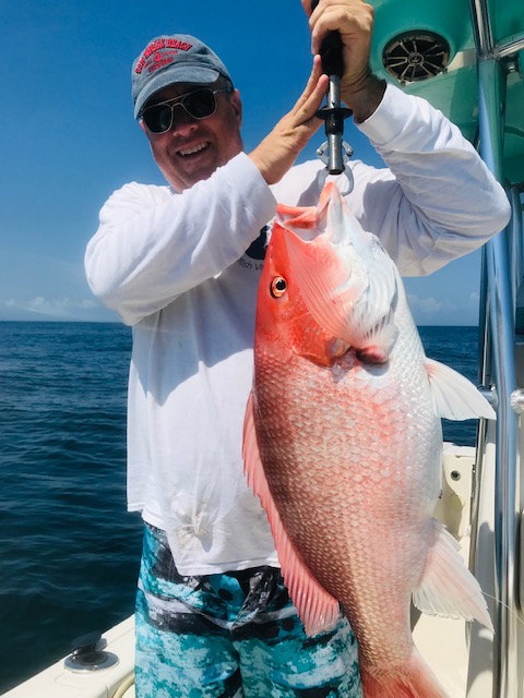 Large red snapper caught fishing in New Smyrna Beach FL waters