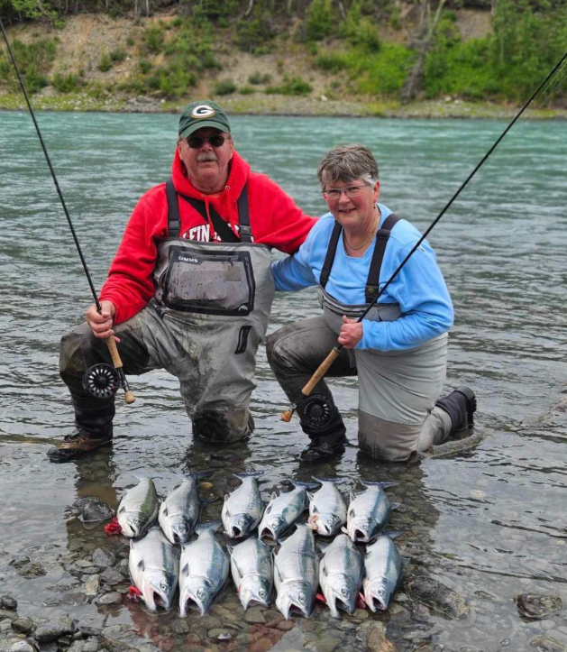 Two people fishing in the beautiful Alaskan wilderness