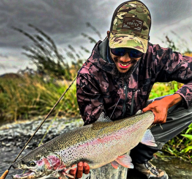 Photograph of a 24-inch rainbow trout caught while fishing in Alaska