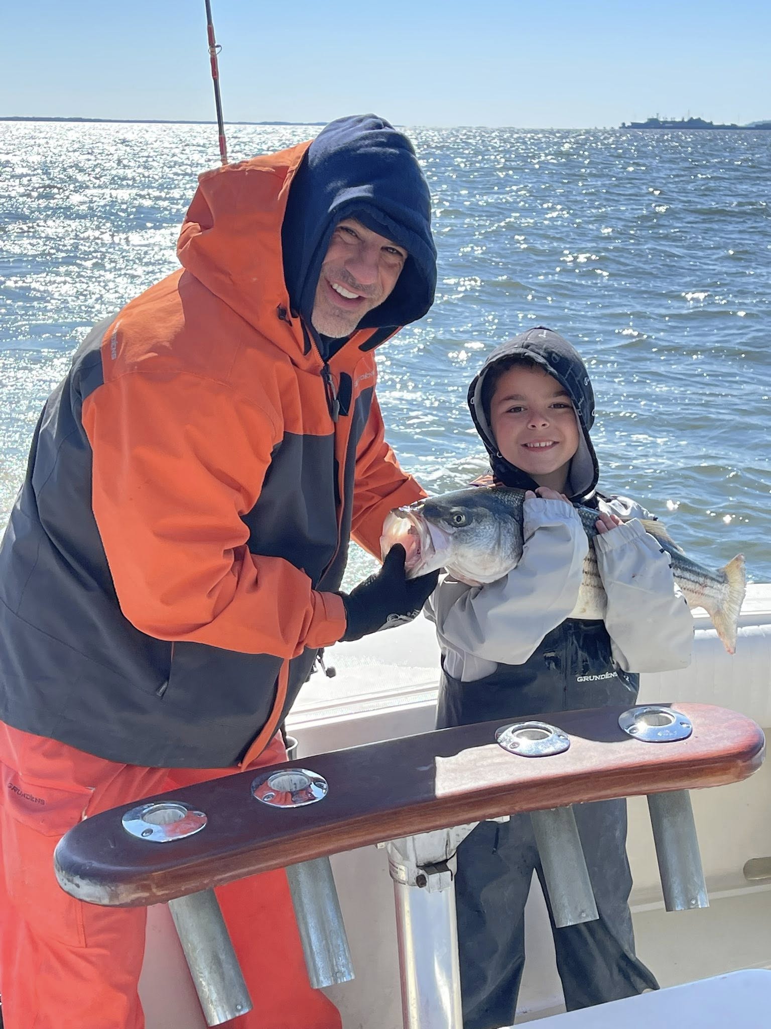 Striped bass fishing charter boat departing Keyport NJ marina for Raritan Bay guided trip