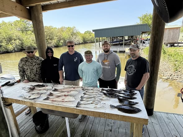 Fresh caught fish displayed on cleaning table at fishing dock in Hopedale LA