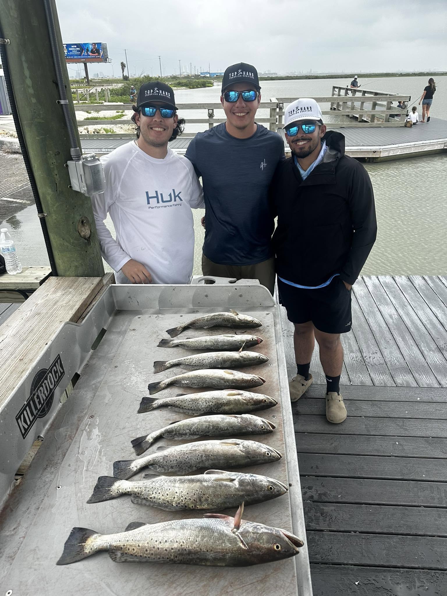Nine speckled trout laid out in cooler after successful fishing trip in Corpus Christi TX
