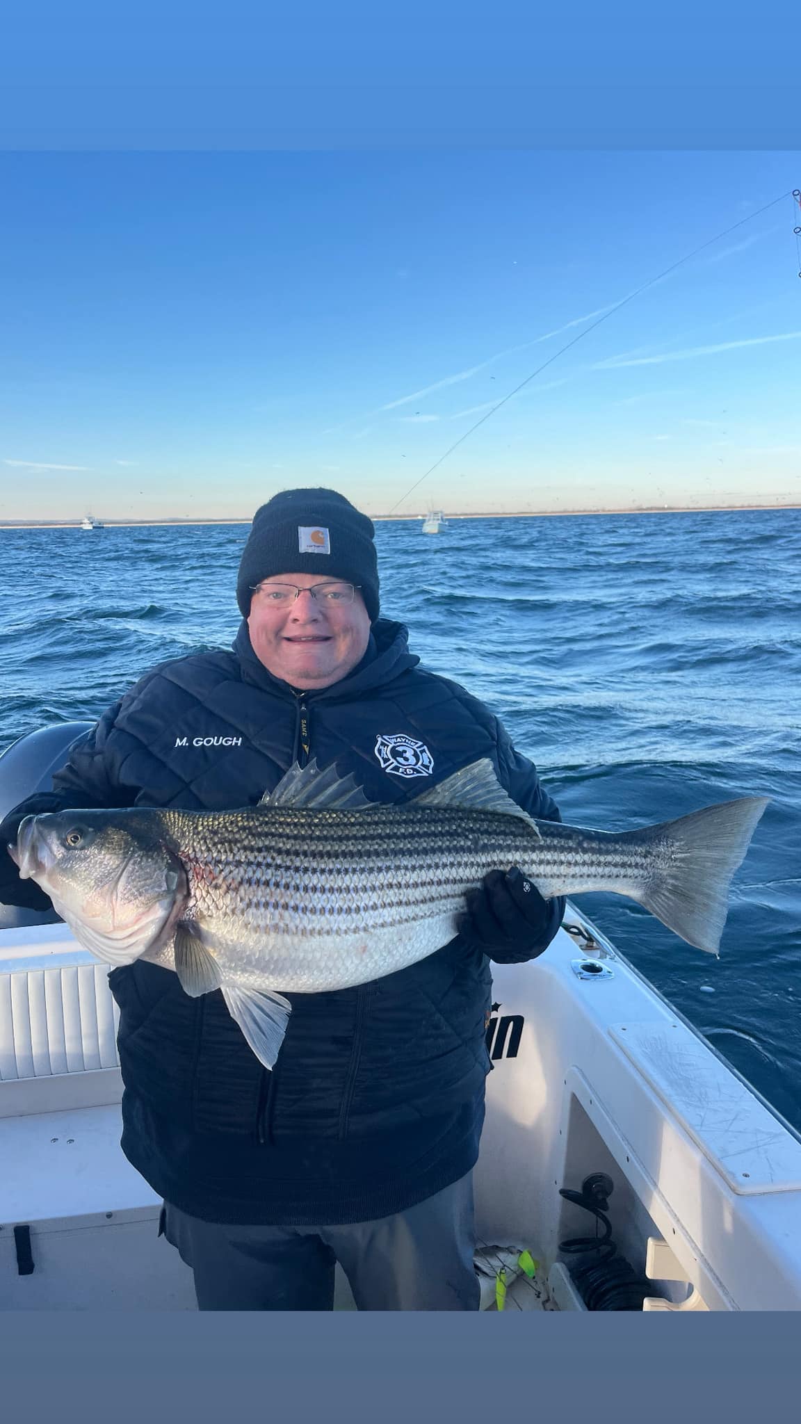 Large striped bass catch on fishing boat in Woodbridge Township NJ waters