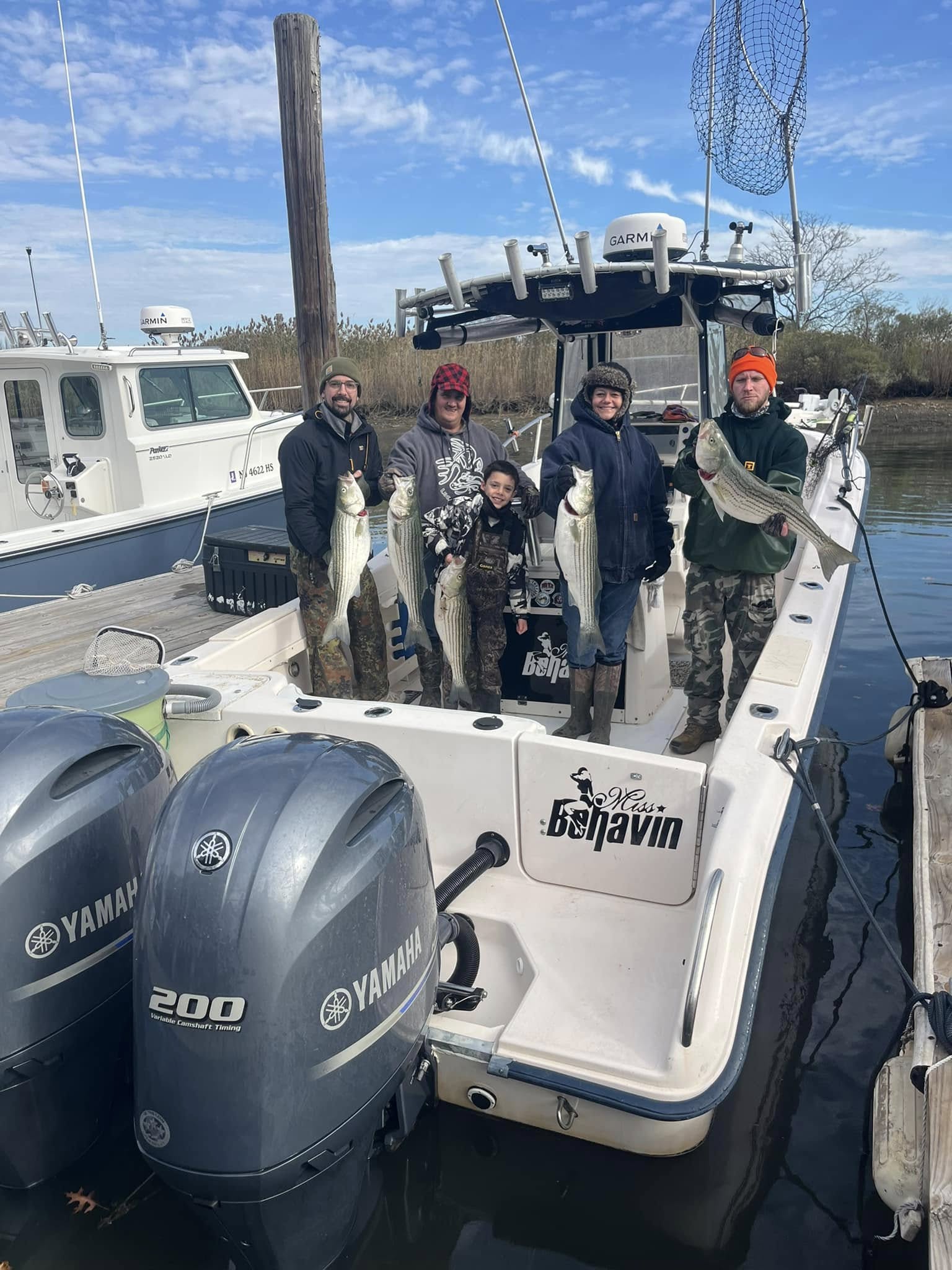 Successful striped bass fishing trip in Woodbridge Township NJ with multiple fish caught