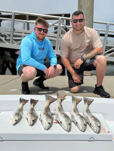 Six redfish catch displayed on dock in Mount Pleasant SC