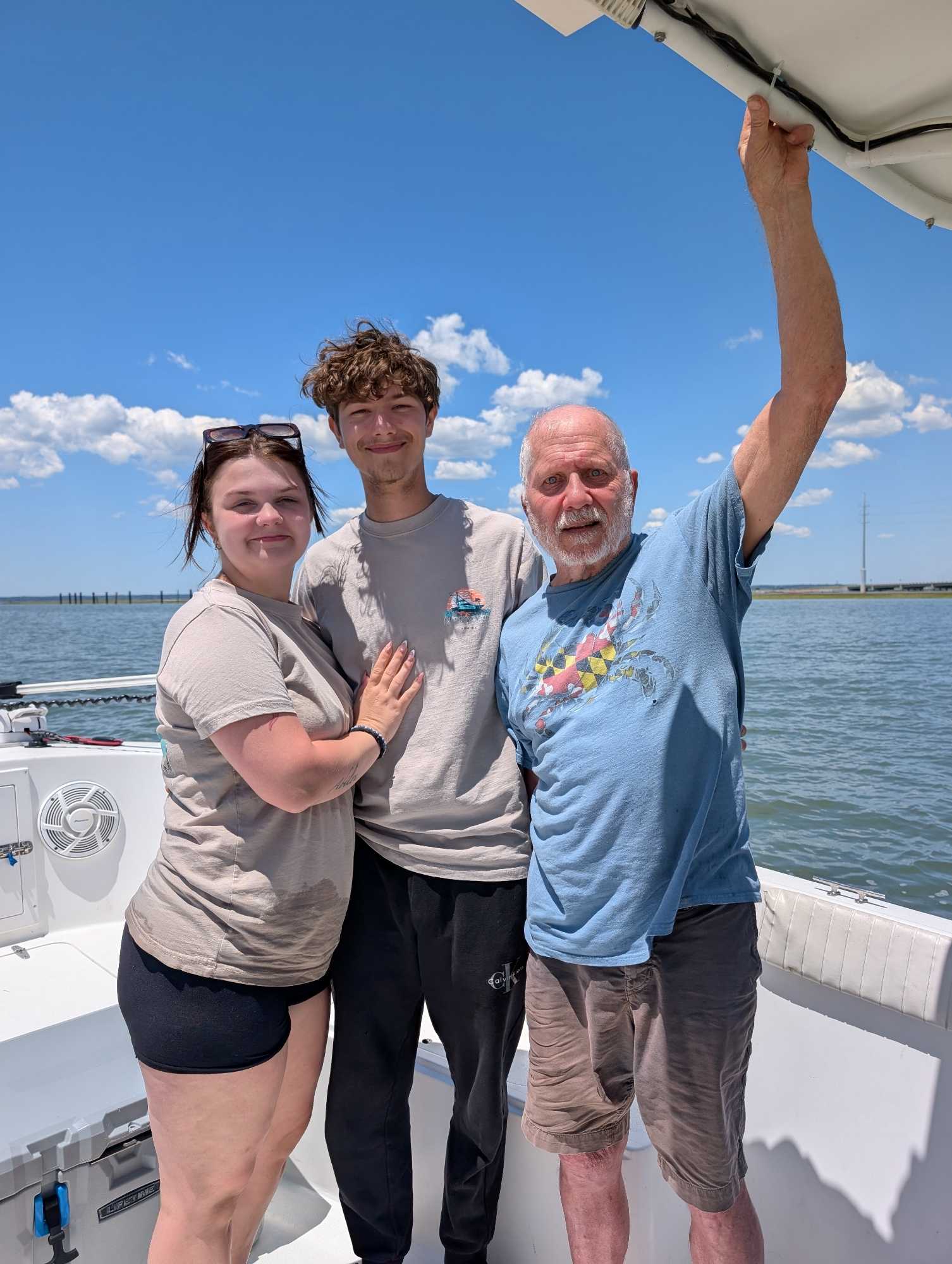 Fishing charter group celebrating on boat deck in Chincoteague VA waters