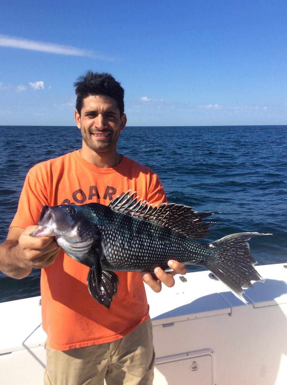 Photograph of a 25-inch sea bass caught in NY