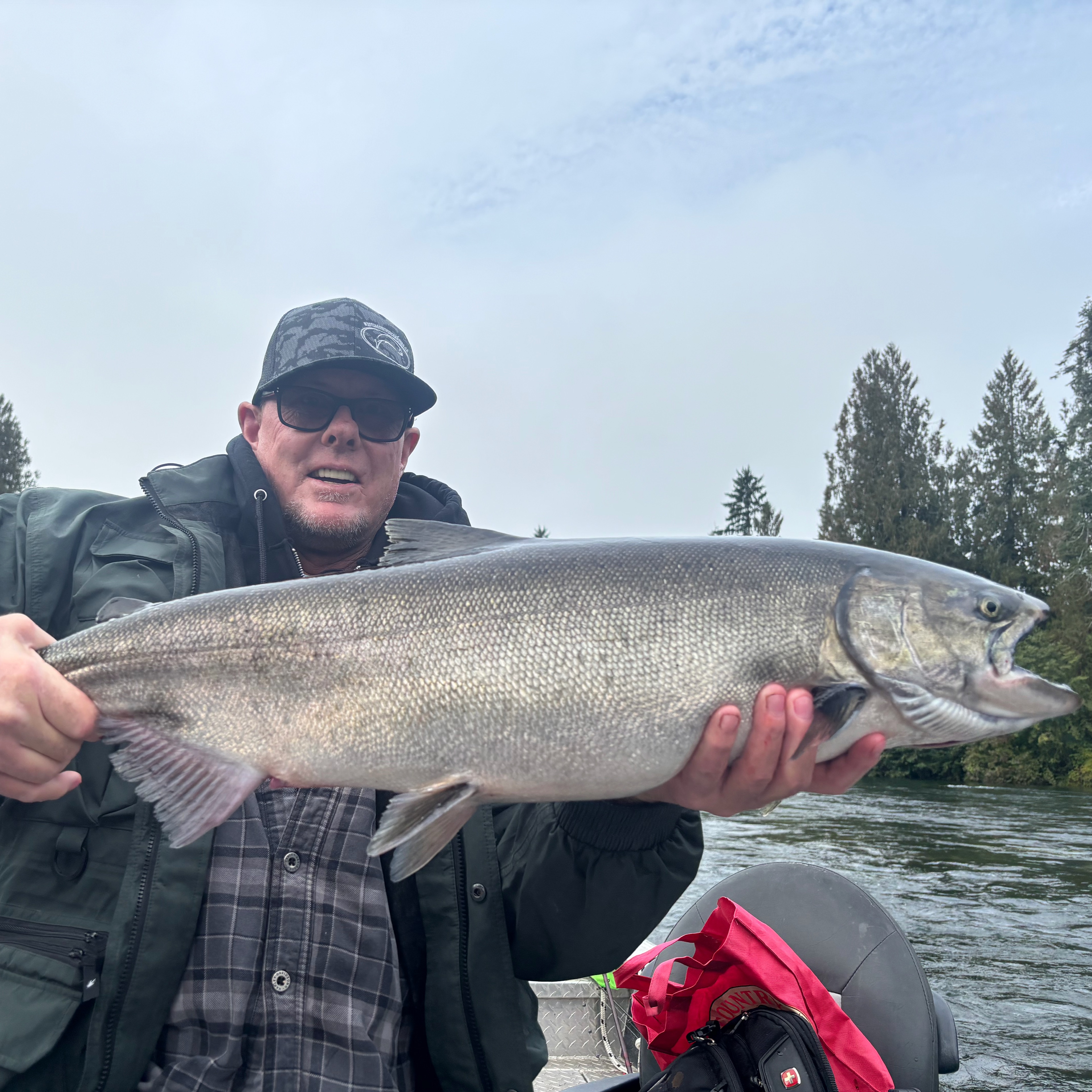 Salmon fishing charter boat on river in Port Alberni BC during fall salmon run season