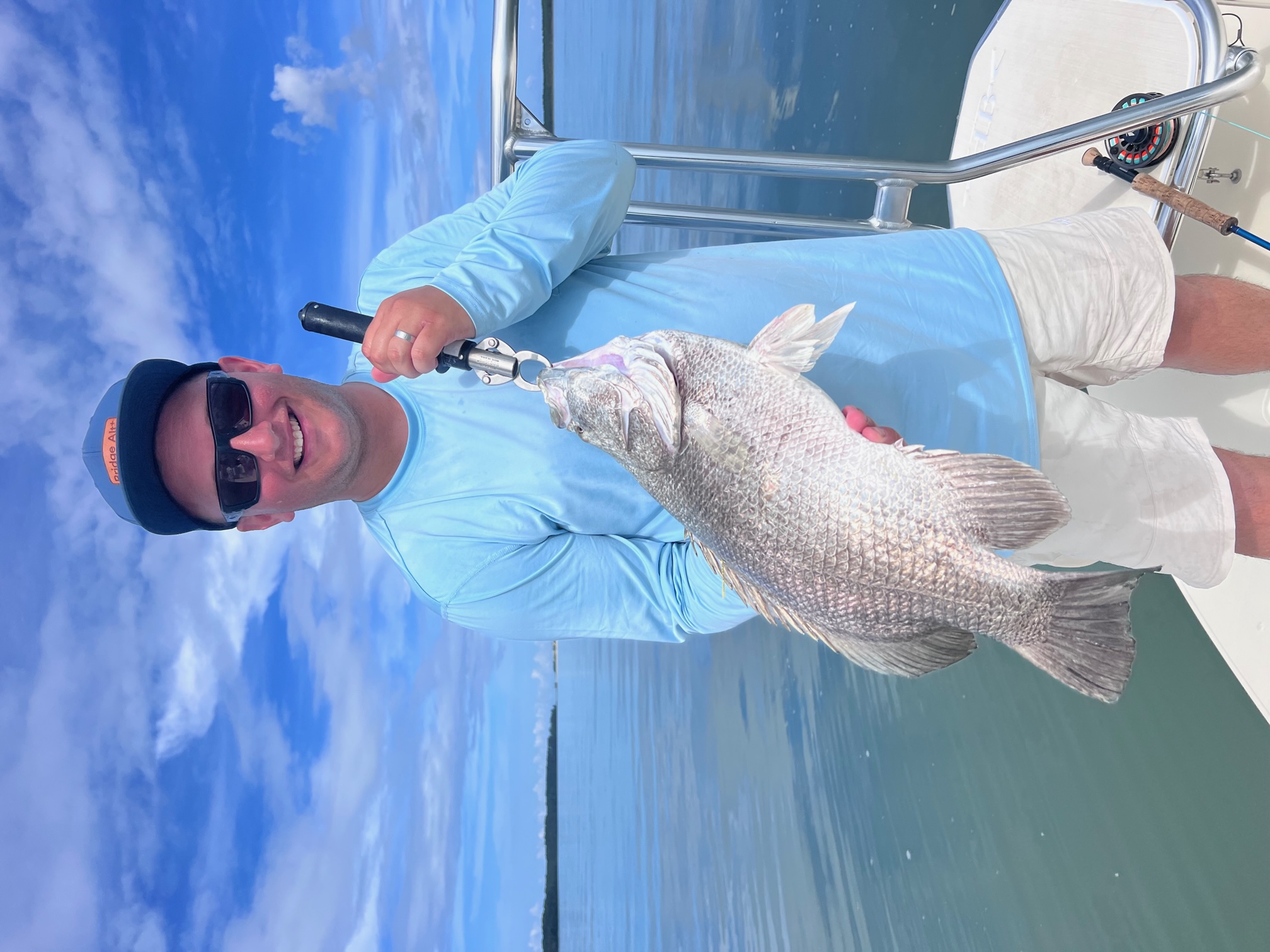 A lone fisherman in Apalachicola, fishing for an 18-inch catch