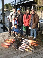 Three people enjoying fishing in Tofino
