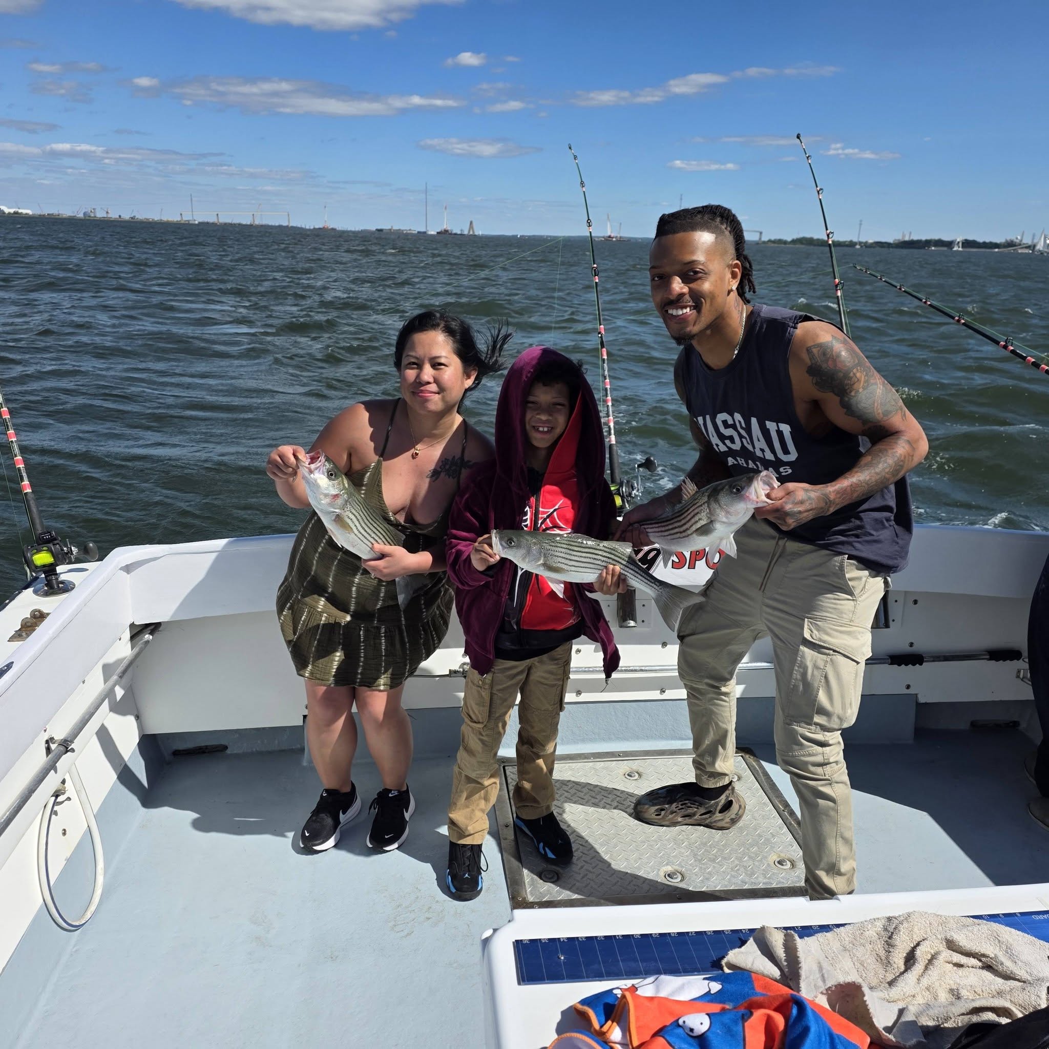 Three striped bass caught during fishing charter in Baltimore MD