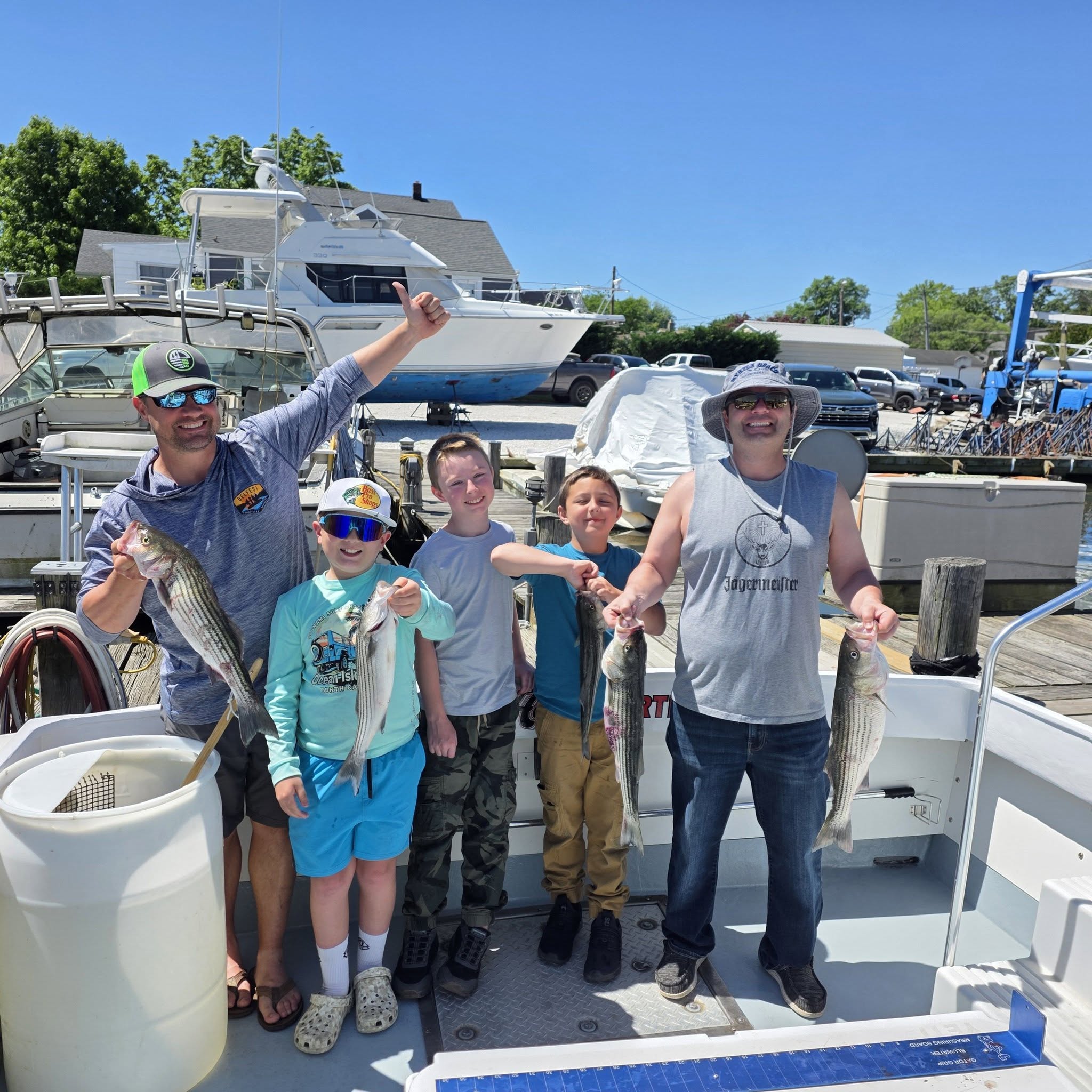 Successful striped bass fishing charter in Baltimore MD with multiple fish caught