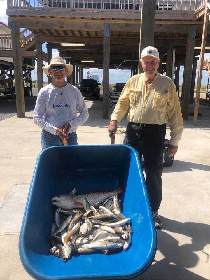 Two anglers with their catch in LA