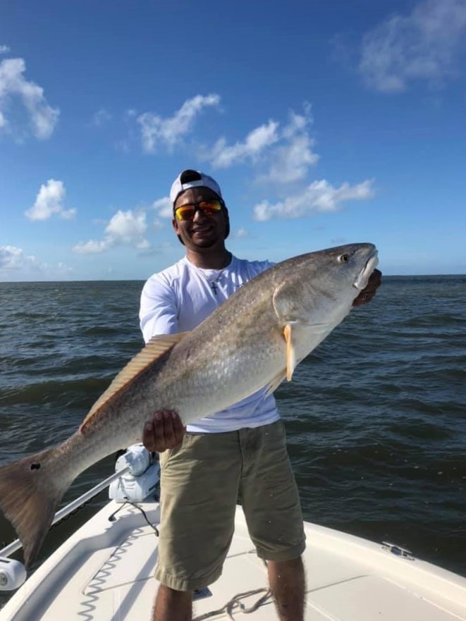 Photograph of a 35-inch redfish caught in LA