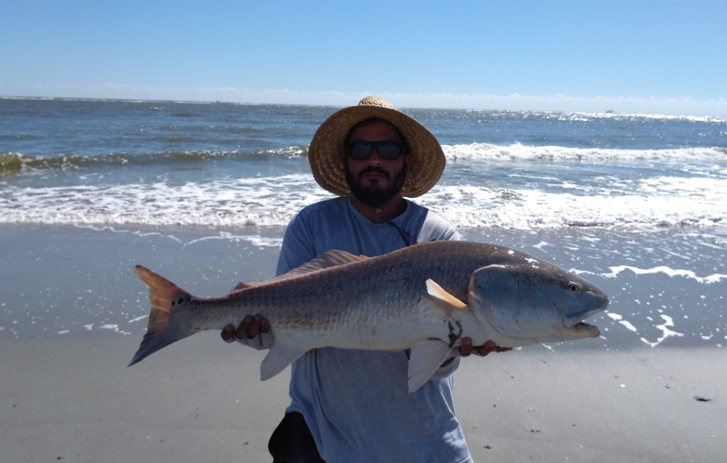 A person fishing at Folly Beach