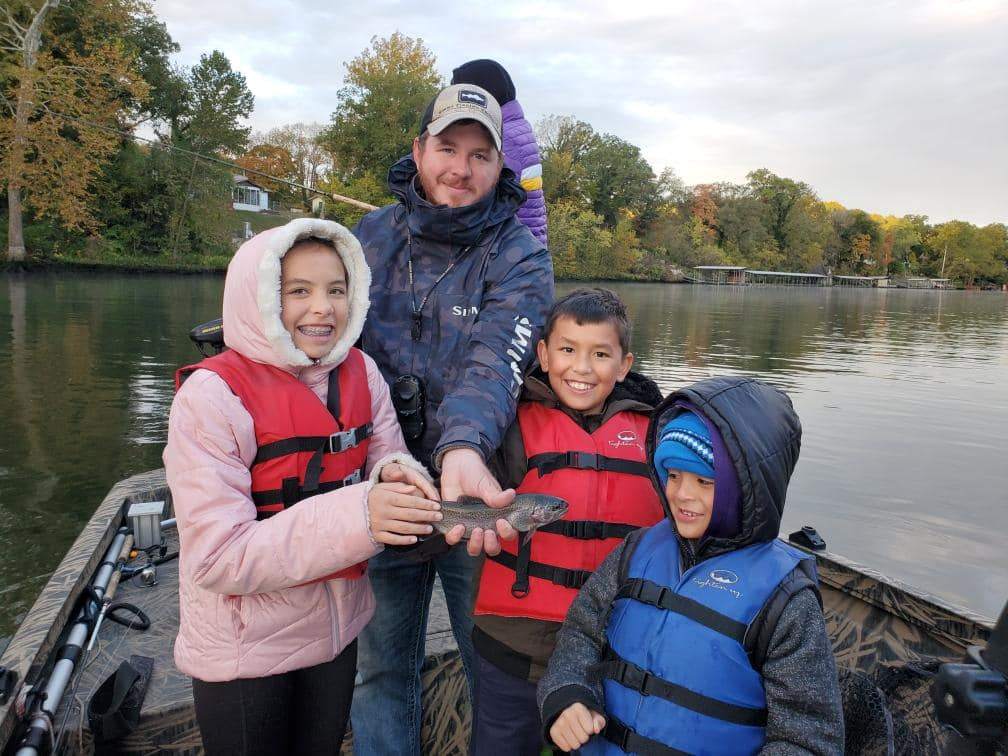 4 people enjoying a fishing trip in Branson